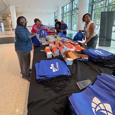 NMSDC-Backpack3 Packing backpacks at the NMSDC.