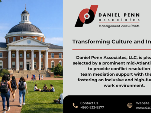 University image with students on the grass and walking.